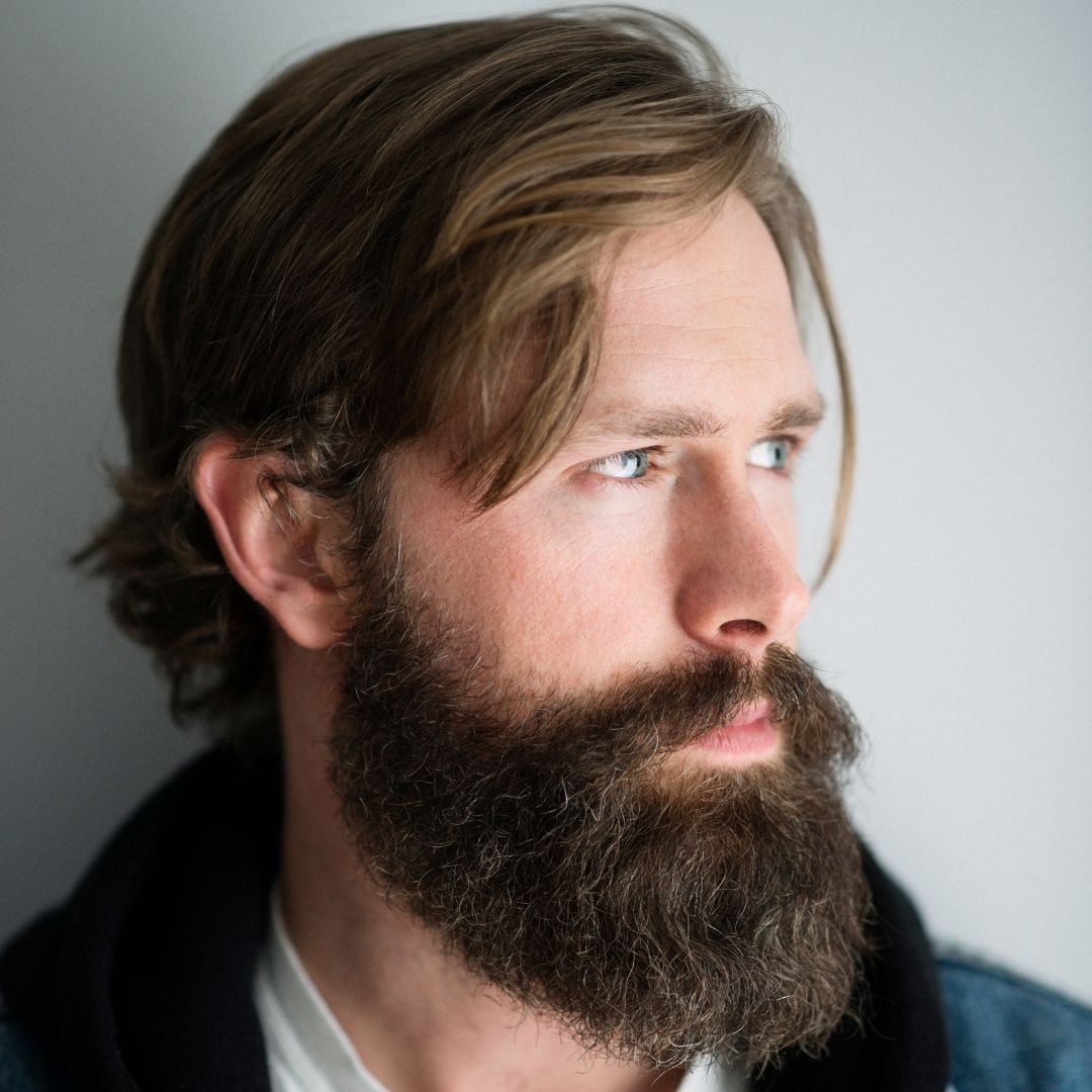 long full beard on man with shaggy hair