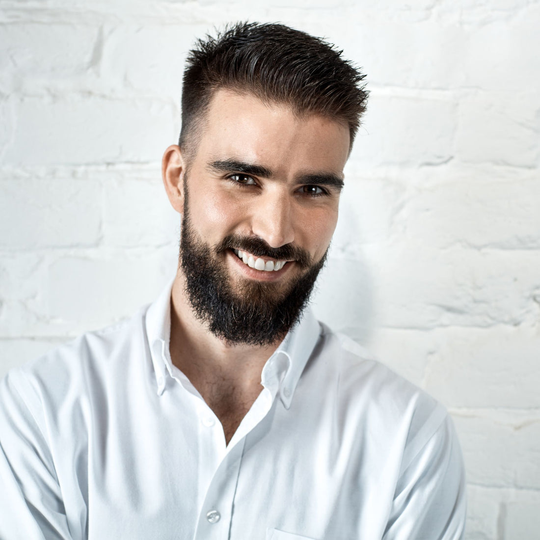 Smiling man with a full beard